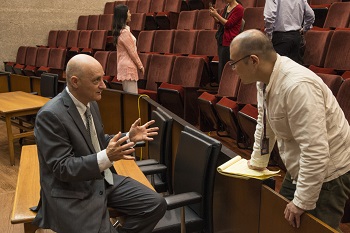 Ben-Shahar talks to a Summer Institute scholar in the Law School courtroom
