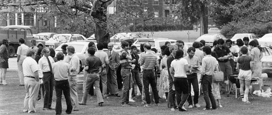 Faculty and students mingle at a 1970s picnic.