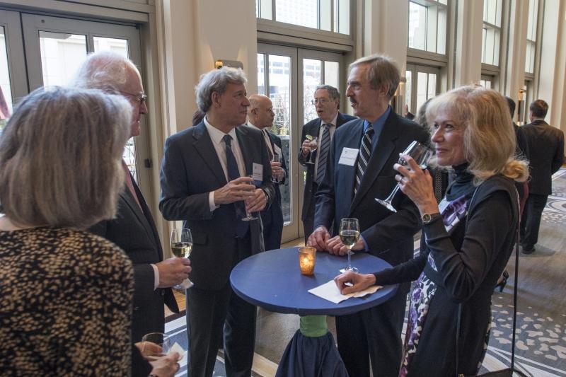 Faculty and alumni chat before the annual Dean's Circle Dinner on Thursday.