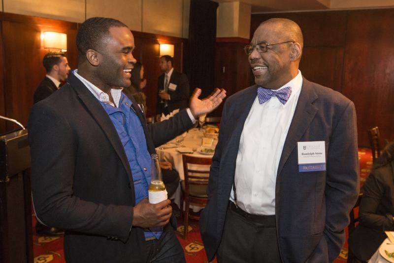 Euler Bropleh, ’08, chats with Clinical Professor Randolph N. Stone at the BLSA Alumni Recognition Dinner.