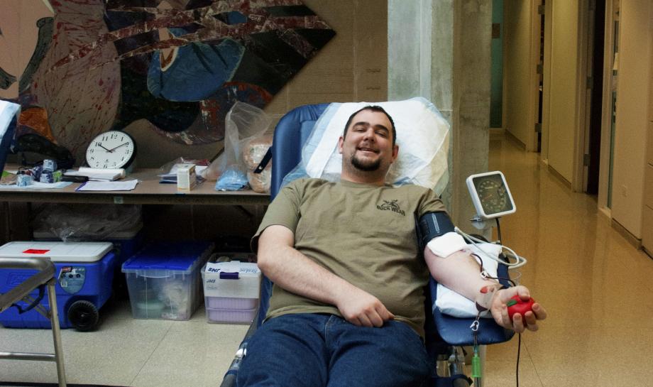 Alex Gross, ’16, gives blood