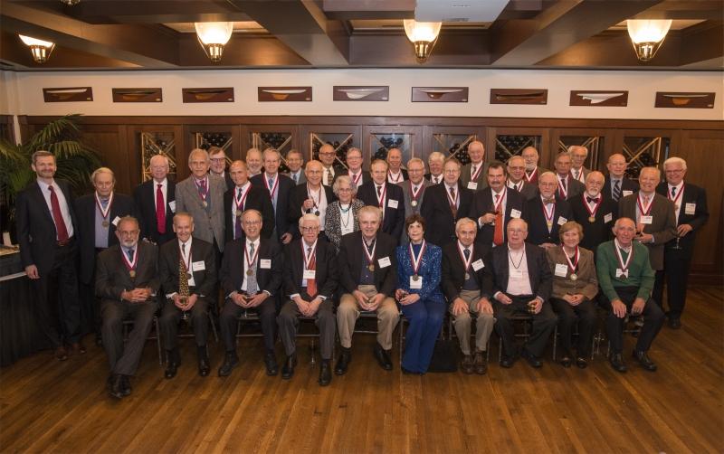 Members of the Class of 1966 posed for a group photo with Dean Thomas J. Miles, the Clifton R. Musser Professor of Law and Economics.