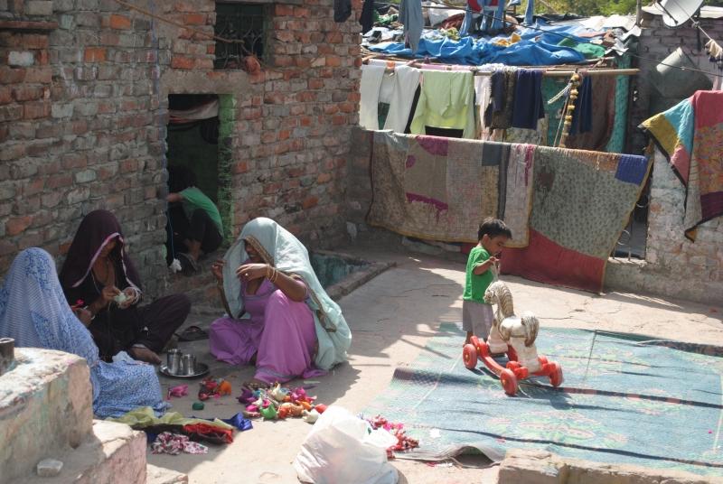 Women creating crafts for market in the Kathputli artist community.