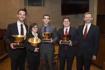 Moot Court team (including Beck) holding trophies