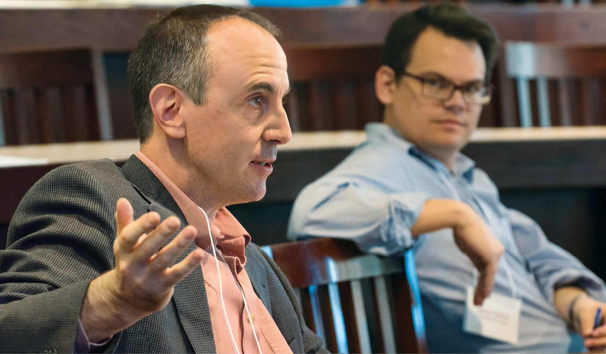 Professor Eric Posner speaks as Professor Adam Chilton looks on