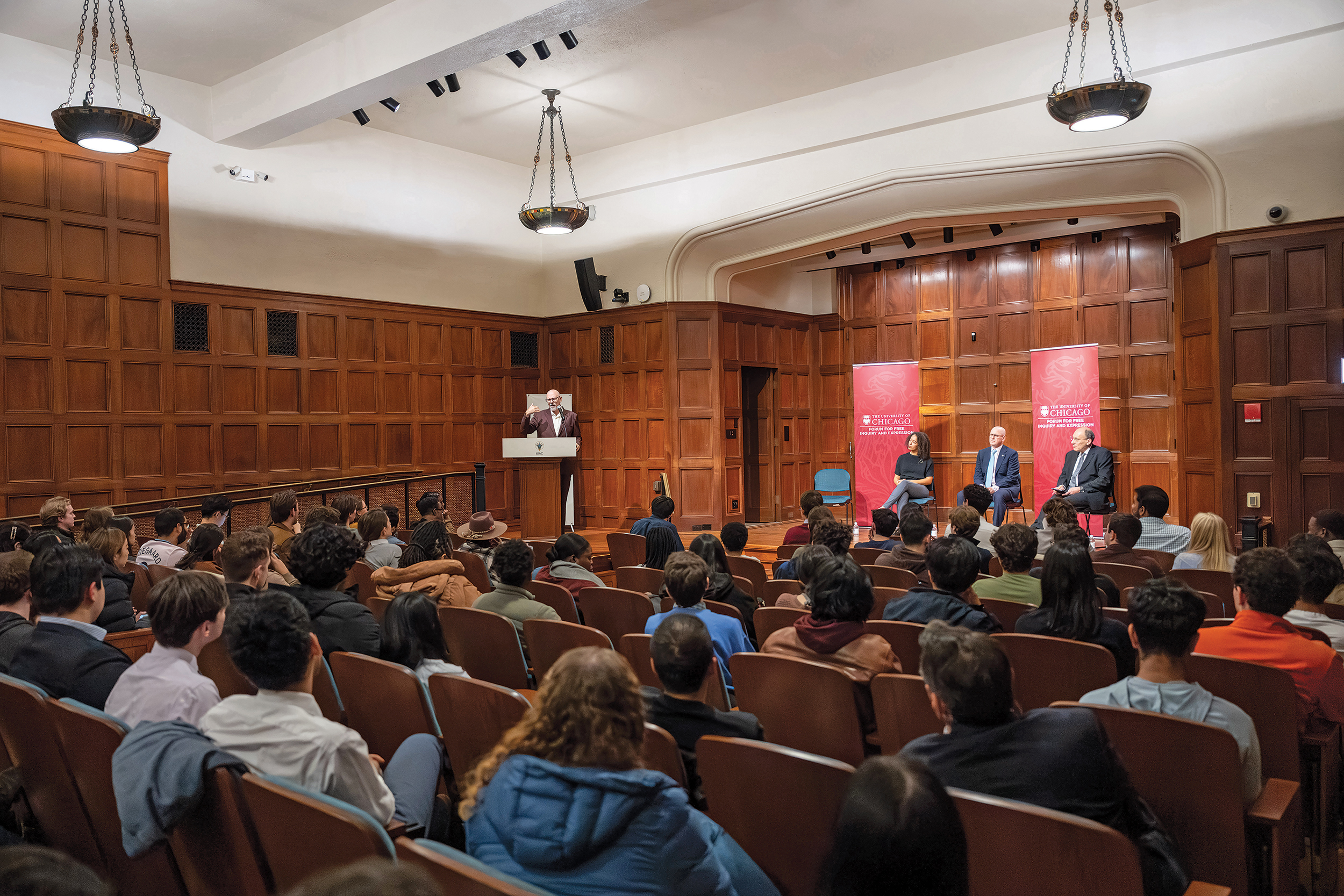 Professor Tom Ginsburg standing at the podium in front of an audience.