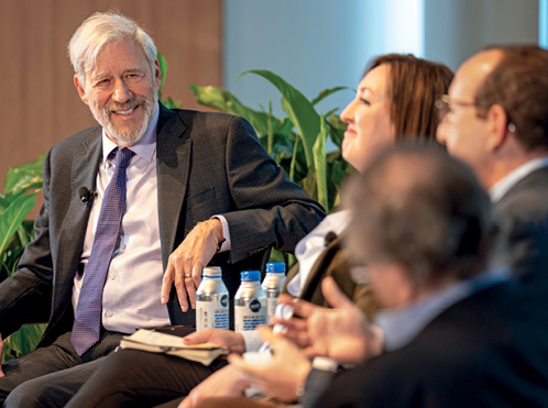 Professor Geoffrey Stone speaking with 3 other people