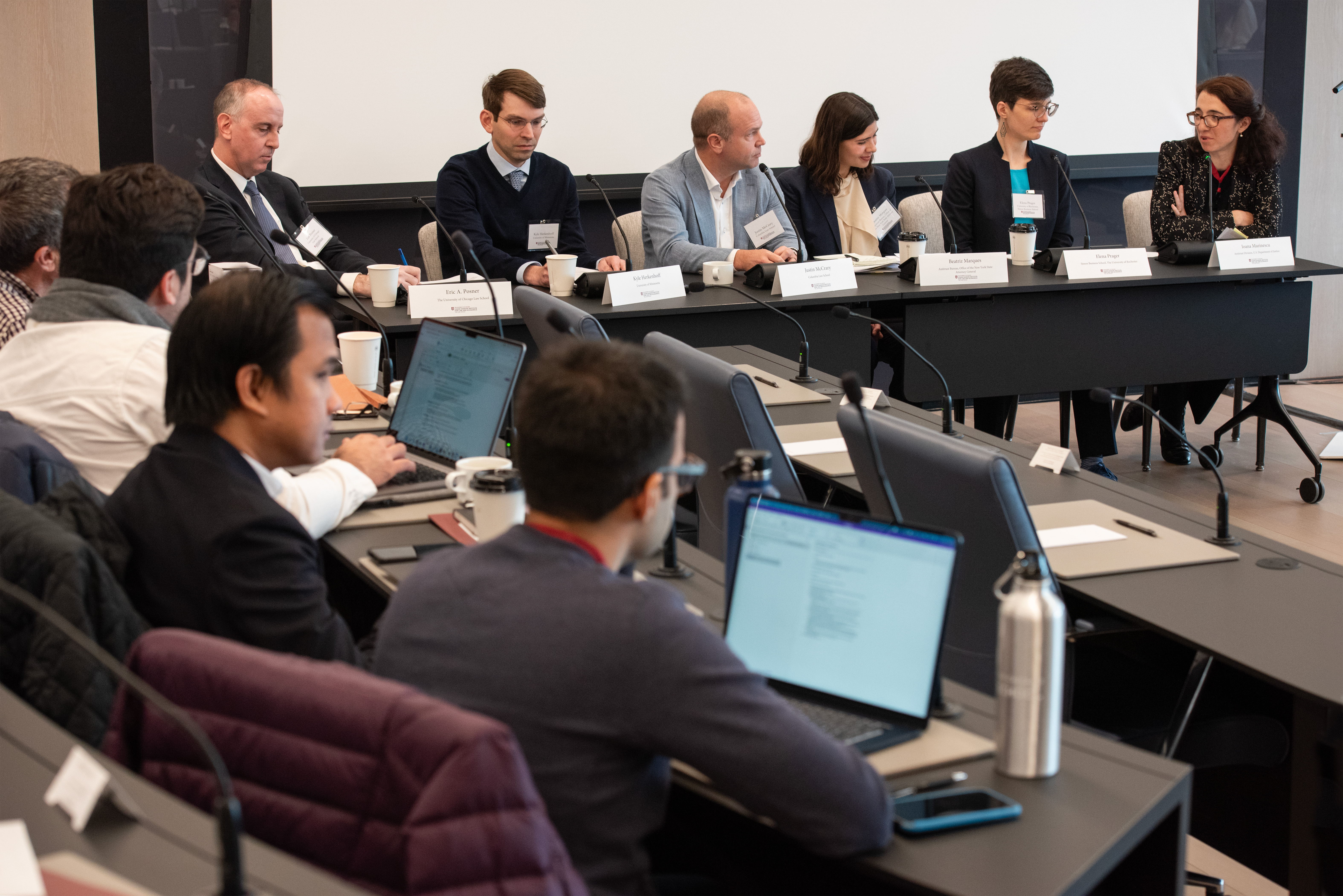 Panelists and attendees at a Coase-Sandor Institute Event