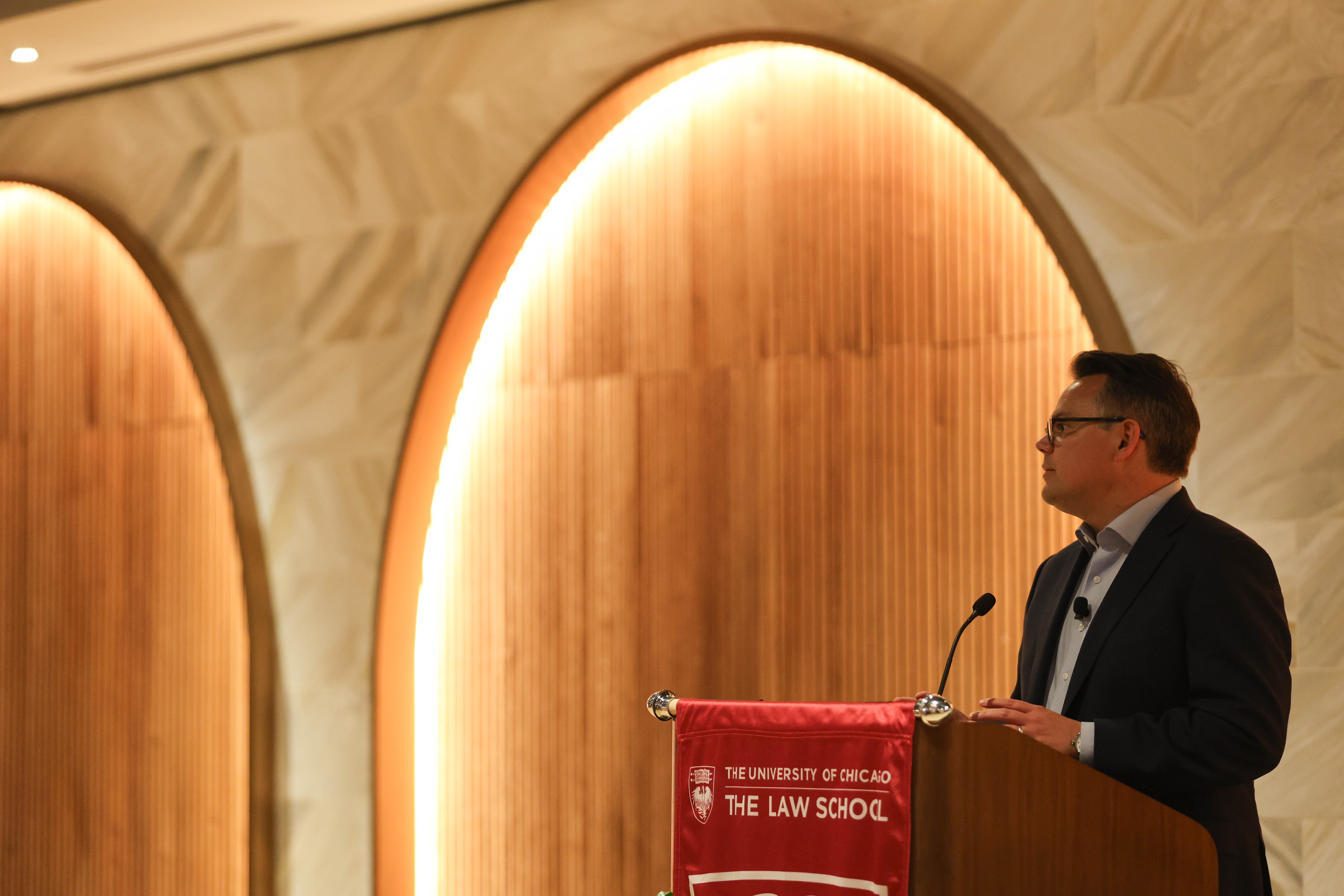Dean Chilton stands at a lectern addressing the audience
