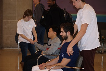 Students receive a massage from a therapist