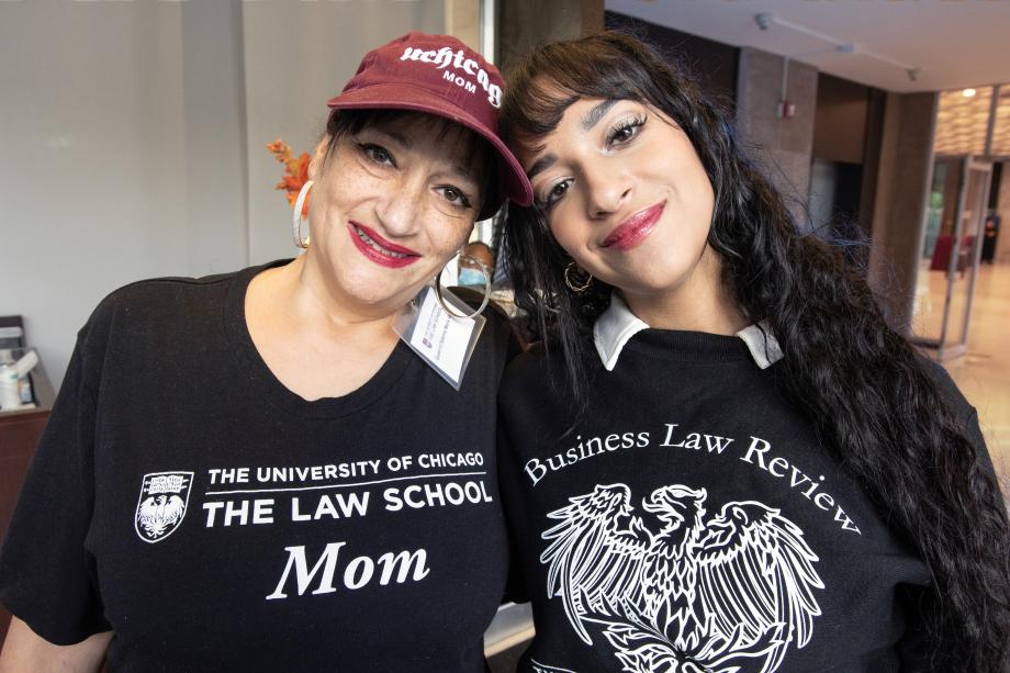 A mother-daughter combination leaning against each other.