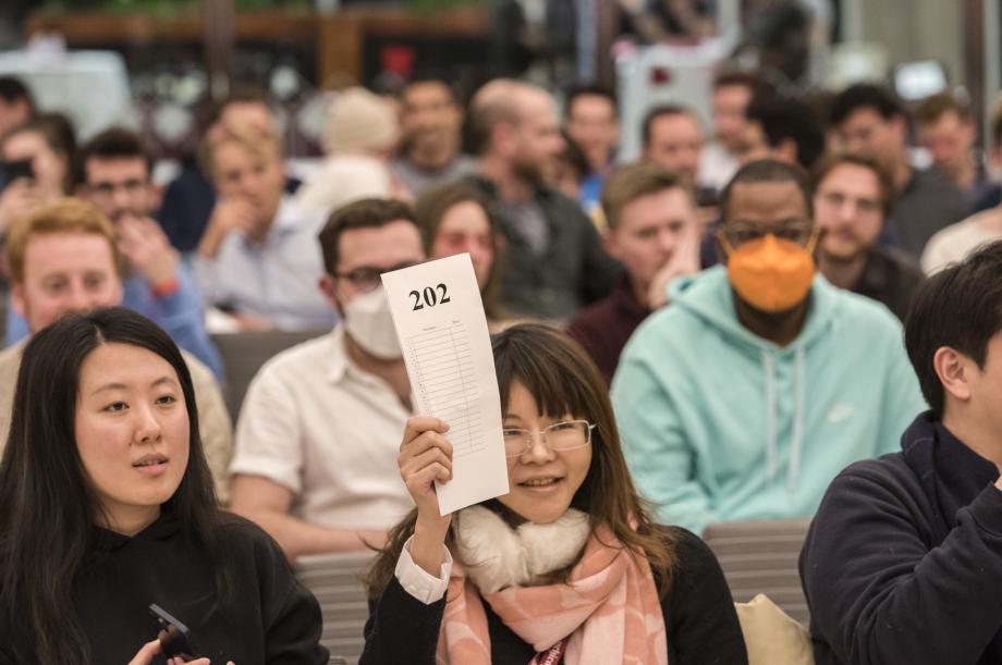 Yung-Wei Chen holds up her bid card.