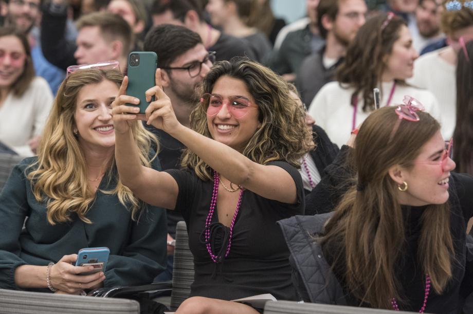 Wearing pink glasses, Thalla Khelghati poses for a selfie while Kristen Kane looks on.