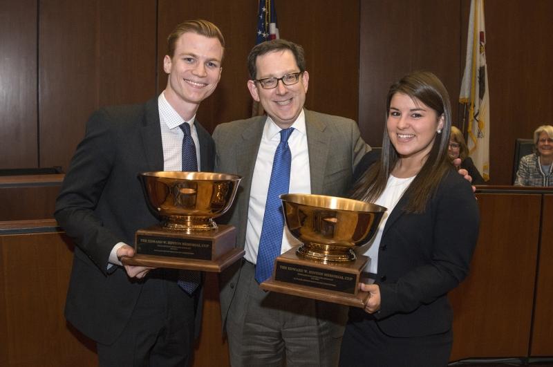 Moot court winners Alex Parkinson, '15, and Jessica Giulitto, '16, pose with Dean Michael H. Schill.