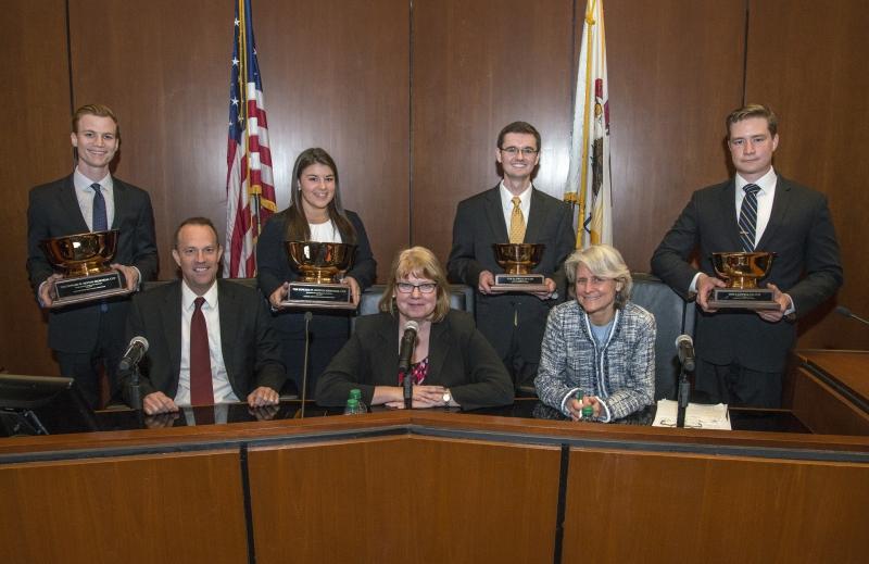 The Moot Court finalists pose with the three-judge panel.