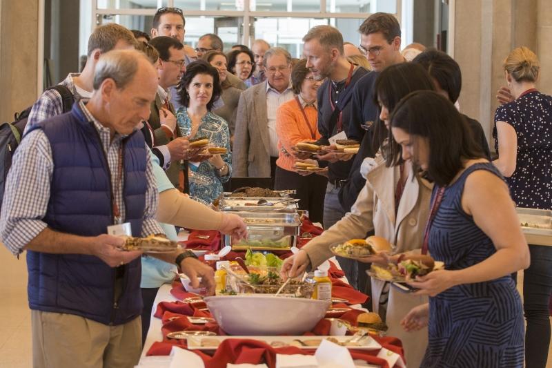 Alumni and their guests enjoy a relaxing picnic lunch in the Green Lounge.