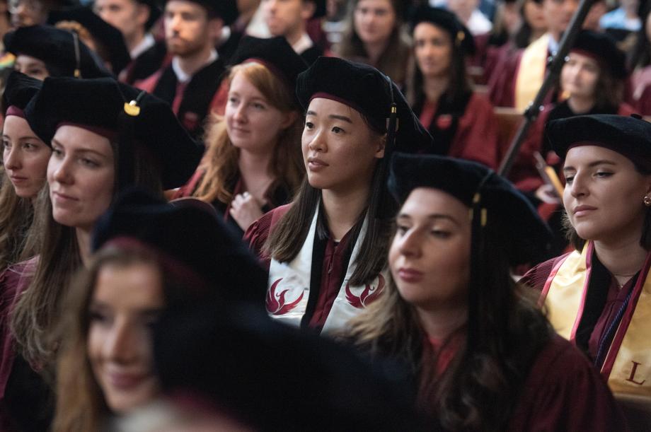 The graduates listen to the three speakers as they acknowledge their successes and offer advice.