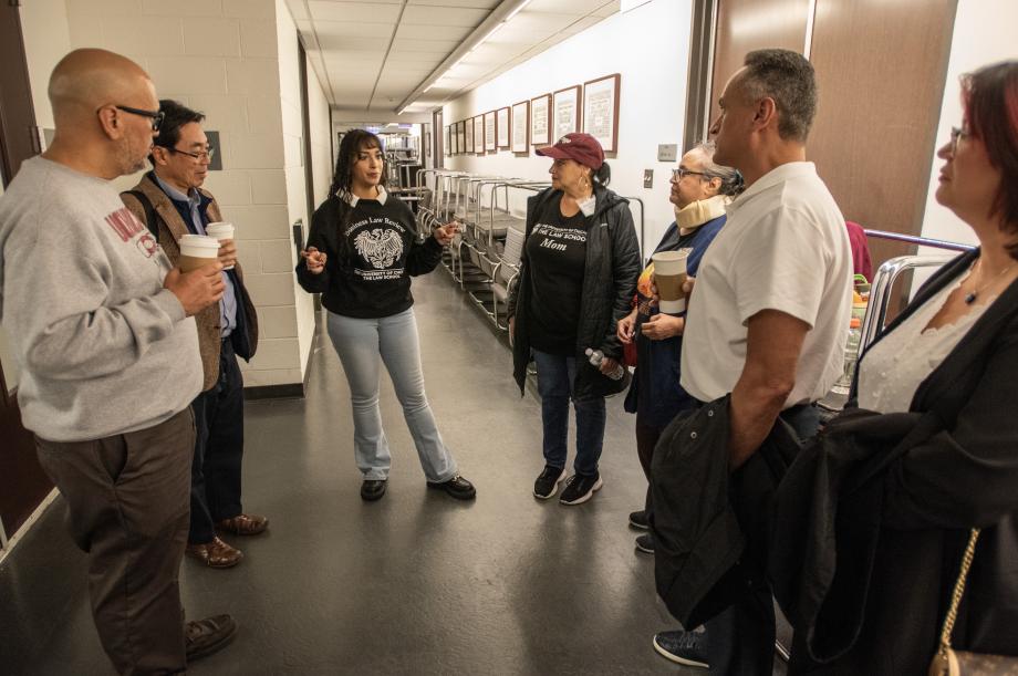 Tour guide speaking to families. 