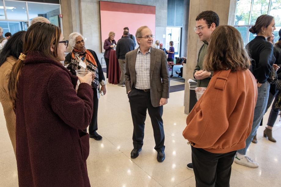 5 people talking to Professor Douglas Baird