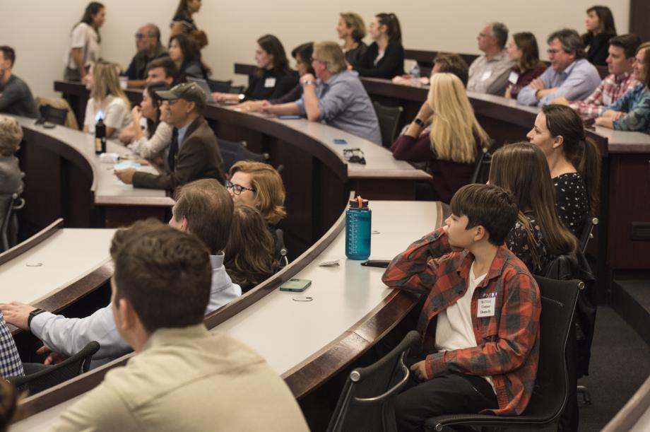 wide shot of families in a classroom.