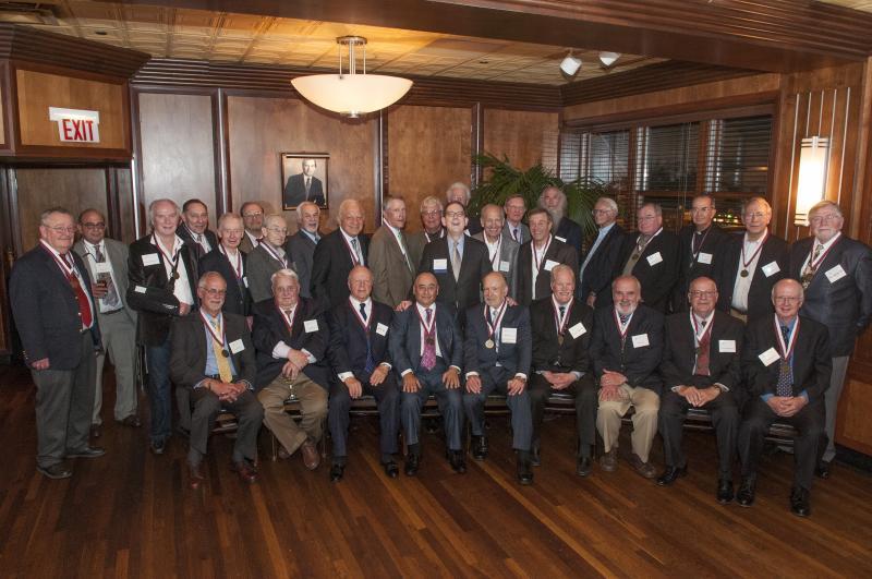 Dean Michael Schill poses with members of the Class of 1963