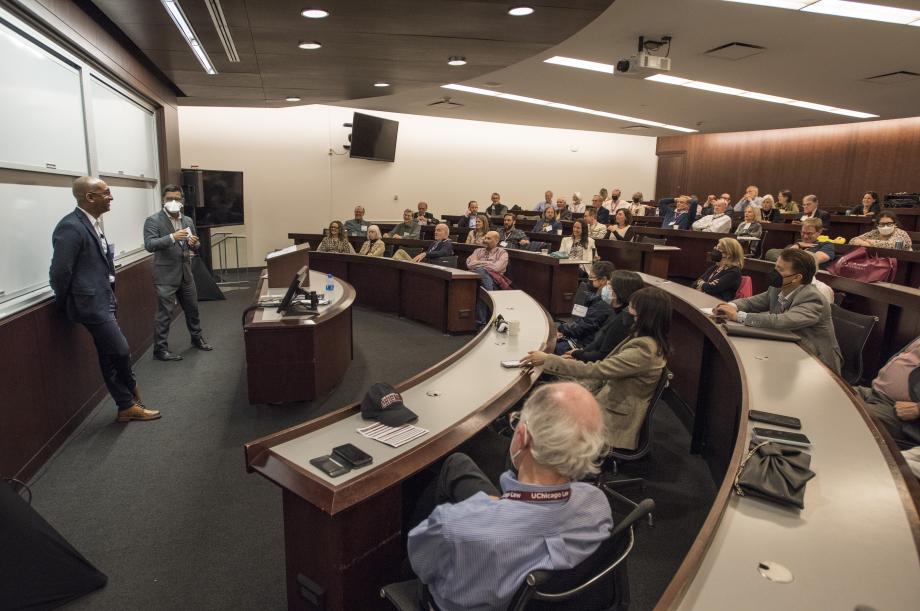 Professors Aziz Huq and Daniel Abebe stand at the front of a classom