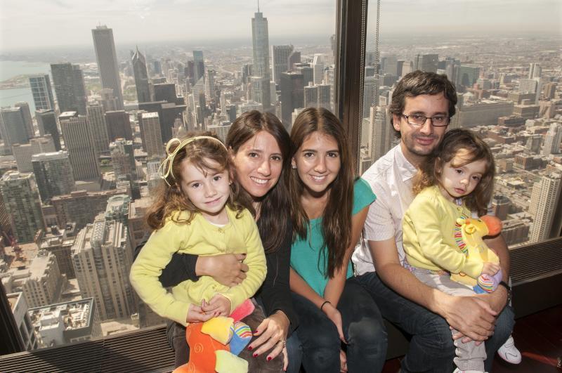 Alumni enjoying the view while attending the Sunday brunch held at the Signature Room on the 95th floor of the Hancock Building