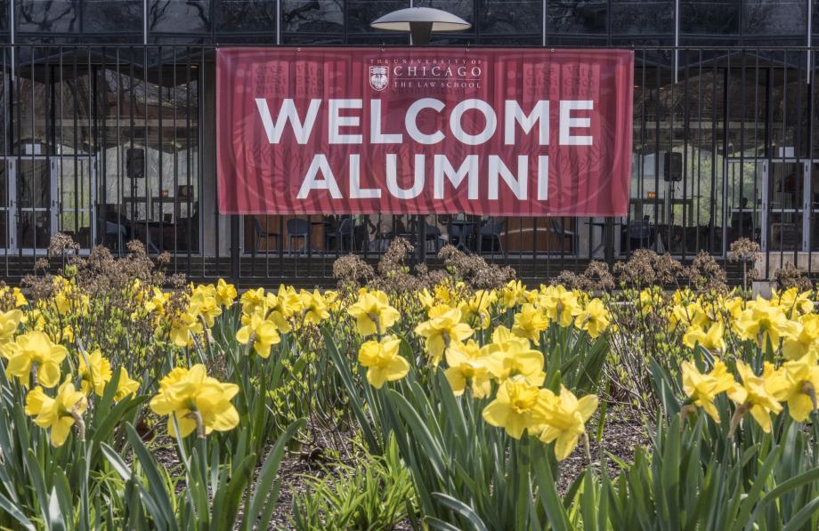 A "Welcome Alumni" banner hangs on the fence in the Laird Bell Quadrangle