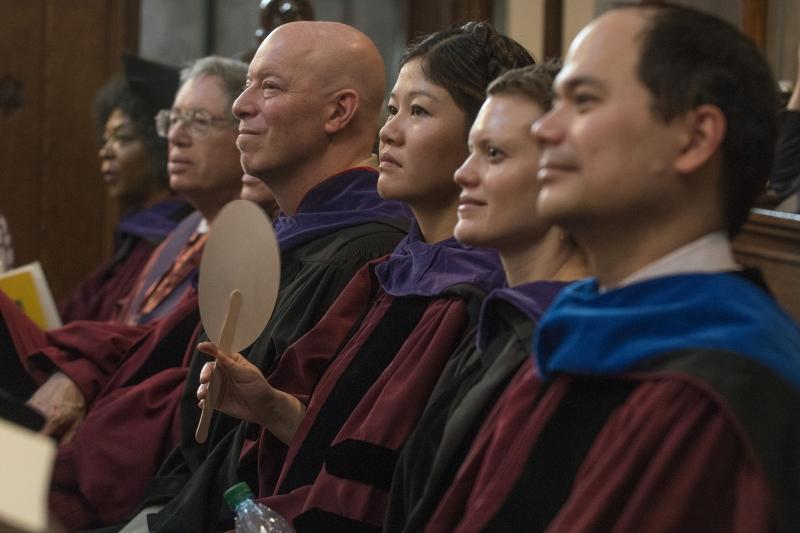 Members of the faculty enjoy the speeches at the Diploma & Hooding Ceremony. Members of the faculty enjoy the speeches at the Diploma & Hooding Ceremony.