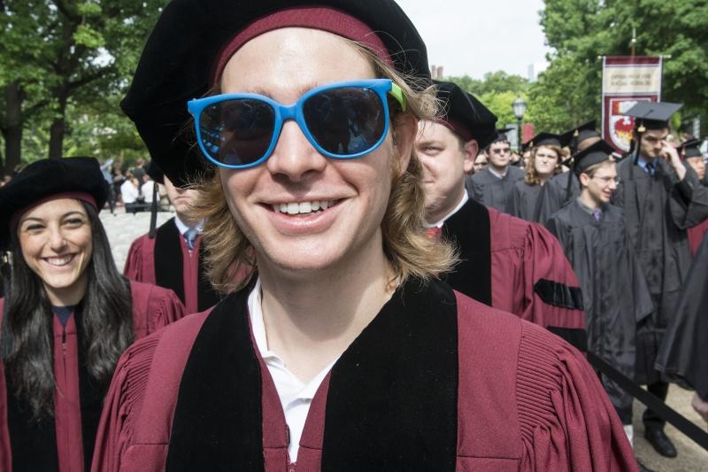 Graduates stay cool during the University's outdoor convocation. Graduates stay cool during the University's outdoor convocation.