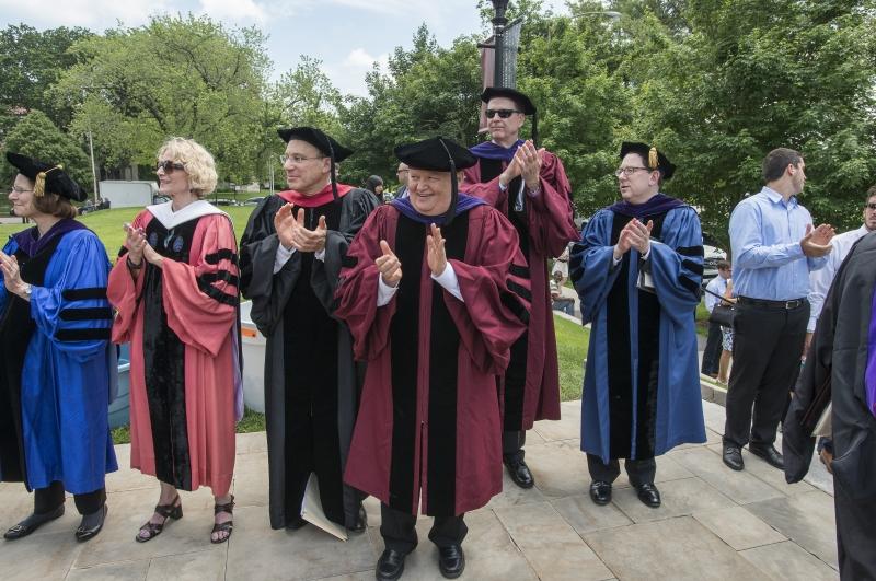 Faculty members congratulate the Class of 2015. Faculty members congratulate the Class of 2015.