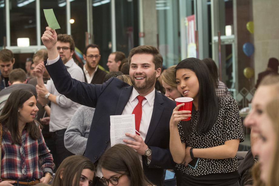 That winter, members of the Class of 2018 attended their first CLF auction. The theme was "Carnival." Here, Andrew Hosea, '18, bids on an item during the live auction. That winter, members of the Class of 2018 attended their first CLF auction. The theme was "Carnival." Here, Andrew Hosea, '18, bids on an item during the live aucti