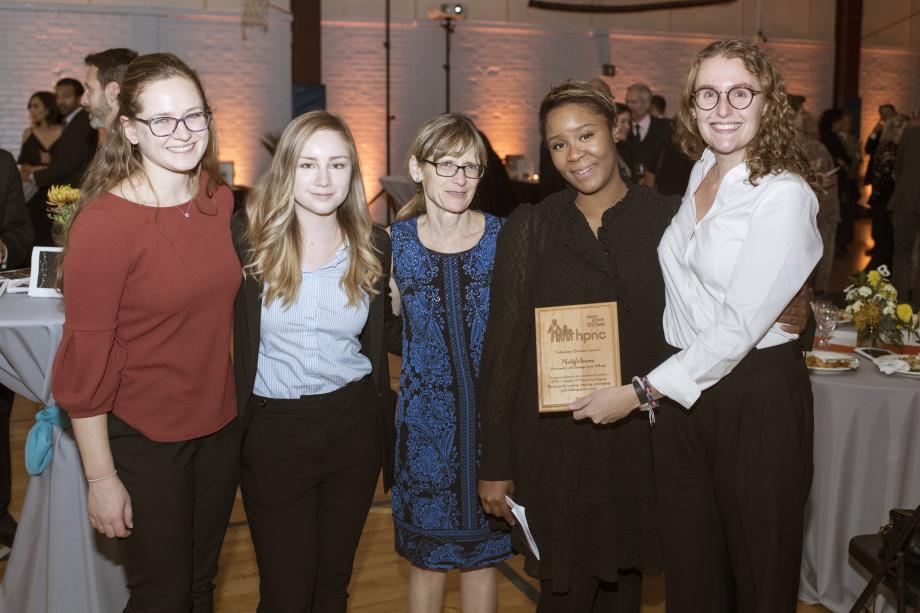 Students in Neighbors holding their award