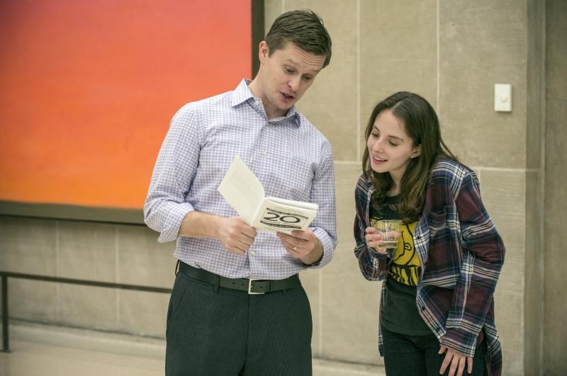 Professor Tony Casey goes over the auction program with Sami Bronner, '18. 