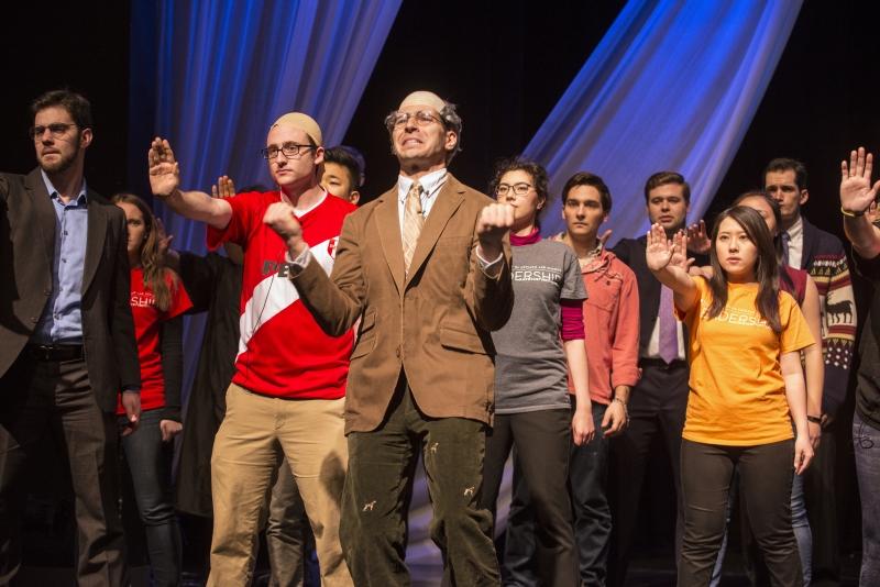 In front, Peter Hegel, ’17, portrays Professor Todd Henderson. In front, Peter Hegel, ’17, portrays Professor Todd Henderson.