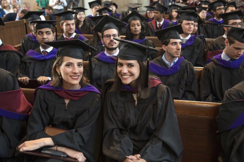 LLM graduates posed for a photo after receiving their hoods. LLM graduates posed for a photo after receiving their hoods.