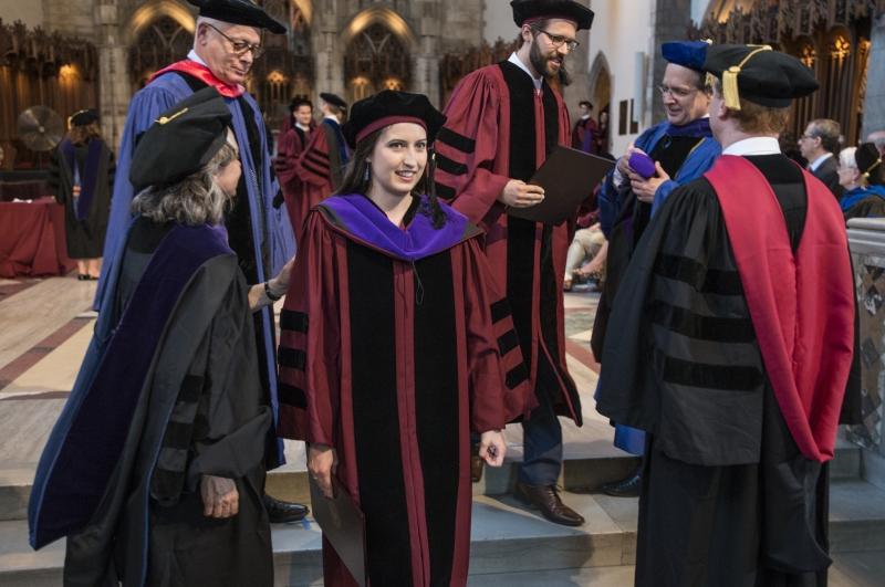 Carmel Dooling, '17, was hooded by Emily Buss, Mark and Barbara Fried Professor of Law, and Saul Levmore, William B. Graham Distinguished Service Professor of Law. Carmel Dooling, '17, was hooded by Emily Buss, Mark and Barbara Fried Professor of Law, and Saul Levmore, William B. Graham Distinguished Service Professor of Law.