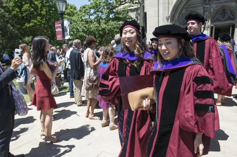 After the ceremony, graduates recessed from Rockefeller Chapel and made their way to the Law School. After the ceremony, graduates recessed from Rockefeller Chapel and made their way to the Law School.