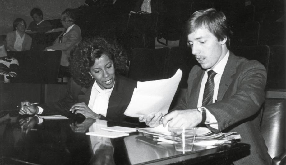 Gail Peek and Bill Engles confer at their table