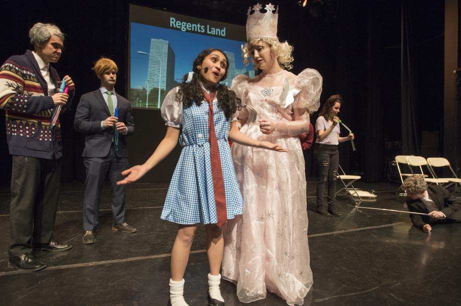 Yogini Patel, '18, starred as Dorothy, the Bigelow Fellow, and Kathleen Martini, '18, starred as Martha Nussbaum, the Good Witch of the Left. Yogini Patel, '18, starred as Dorothy, the Bigelow Fellow, and Kathleen Martini, '18, starred as Martha Nussbaum, the Good Witch of the Left.