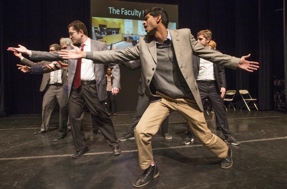 Rahul Srinivas, '19, playing Professor Daniel Hemel, leads the male professors in a Backstreet Boys number. Rahul Srinivas, '19, dressed as Professor Daniel Hemel, leads the male professors in a Backstreet Boys number.