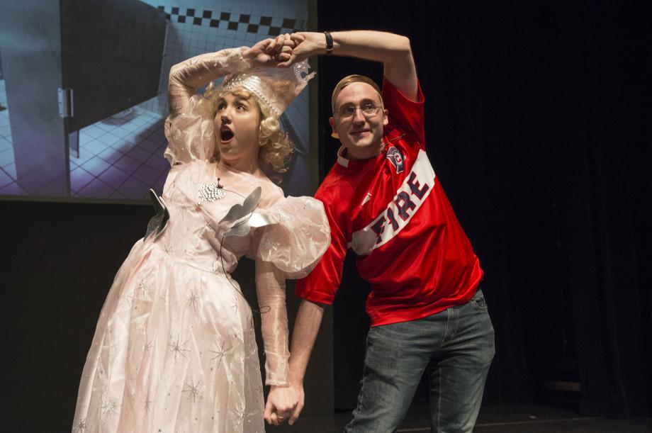 The Good Witch of the Left dances with Adam Mortara, the Wicked Witch of the Midwest (played by Mark Burnside, '18). Their music: "Law is an Open Door," a parody of a song from Frozen. The Good Witch of the Left, dances with Mark Burnside, '18, as Adam Mortara, the Wicked Witch of the Midwest, to "Law is an Open Door," a parody of a song from Frozen.