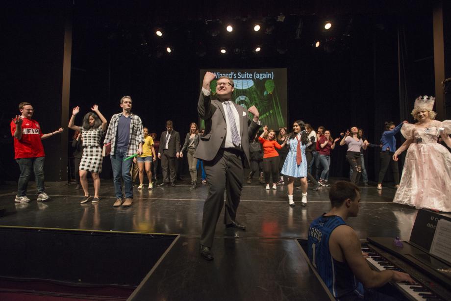 The student playing Baird sings "All in This Together" from High School Musical. Dallin Jack, as Professor Baird, sings "All in This Together" from High School Musical.