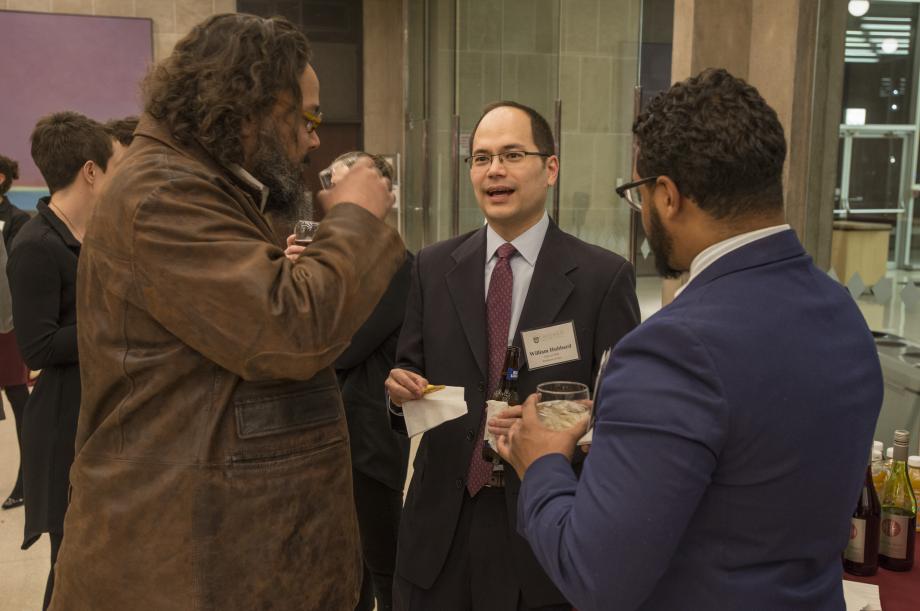 Nat Piggee, '00, and Alex Bolden, '18, talk with Professor William Hubbard at the cocktail hour. 