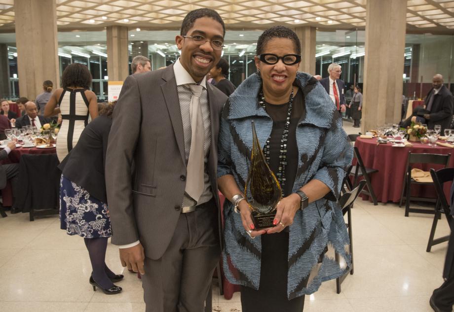 André J. Washington, '19, is one of many to take a photo after dinner with the first recipient of the Parsons Award, Judge Williams. 