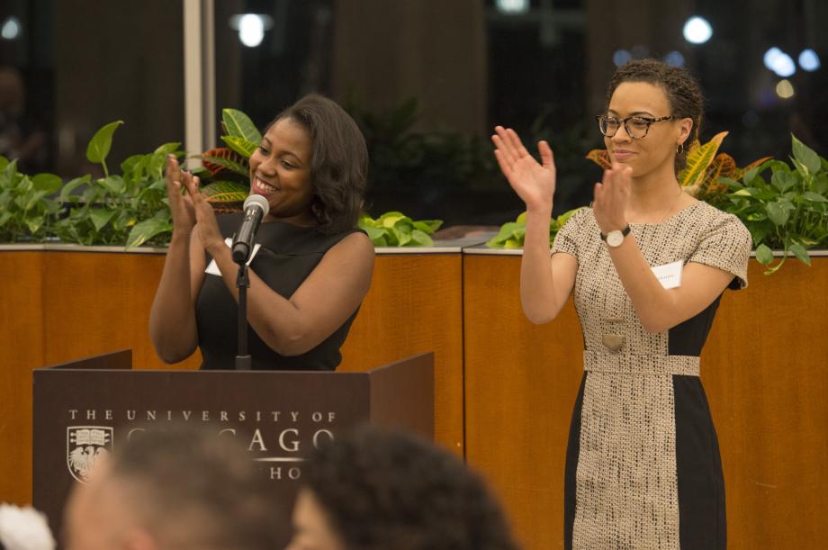 Kimberly Waters, '19, and Laurel Hattix, '19, both members of the BLSA planning committee, give closing remarks and congratulate Judge Williams. 