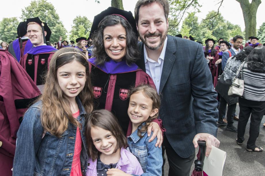 Danielle Johnson, '18, posed for a photo with her husband and children outside of Rockefeller Chapel.