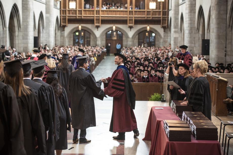 Dean Miles presented LLM graduates with their diplomas while Richard Badger, Associate Dean for Graduate Programs, read their names.  