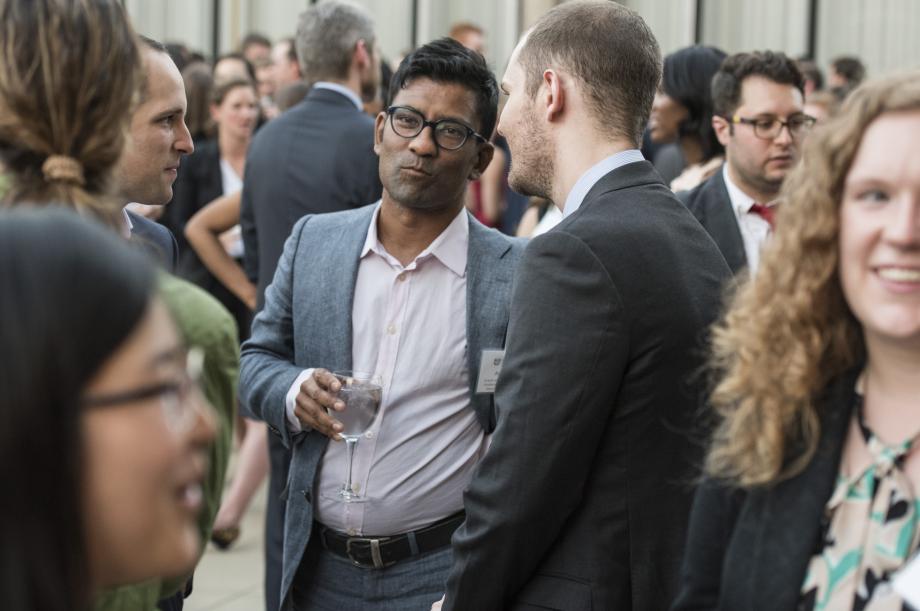 Professor Aziz Huq with several students.