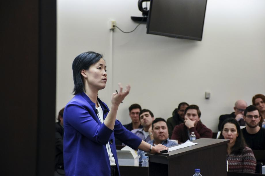 Jennifer Nou teaches from a lectern